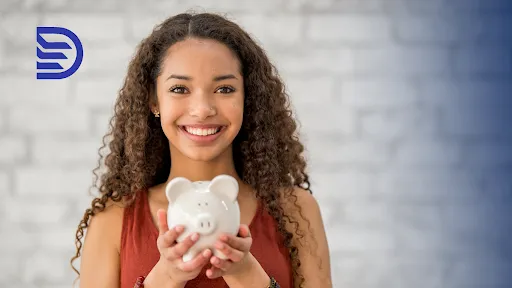 smiling young woman holds a piggy bank with both hands