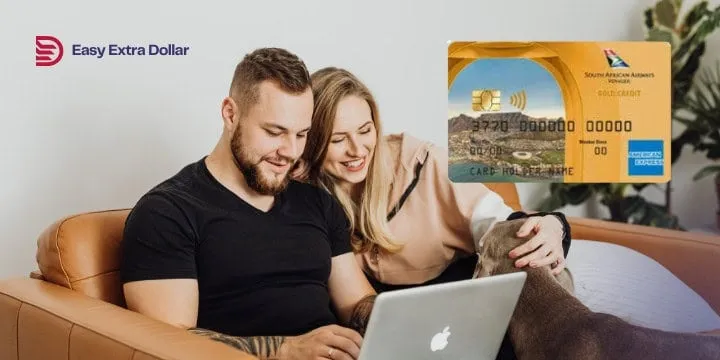 Couple on computer looking at credit card